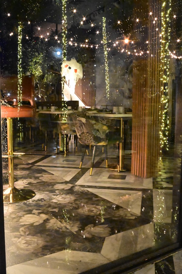 Window reflections with café chairs